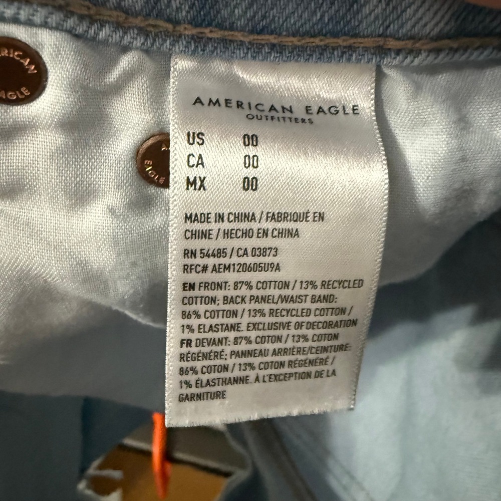 American Eagle Strigid Light Wash Mid Waisted Distressed Denim Shorts Size 00 - Picture 5 of 9